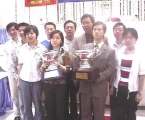 Chinese teams holding the trophies